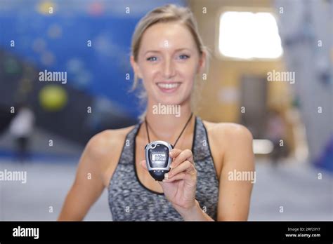 trainer showing the stop watch Stock Photo - Alamy