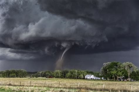 Wray Colorado Tornado - Tornado drops down from wall cloud over Wray Colorado. Photography by ...