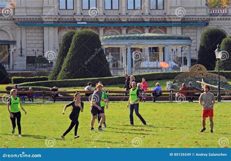 People are Playing Frisbee in City Park Editorial Stock Image - Image of happiness, action: 80126549