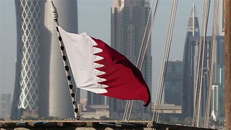 QATAR-FLAG-WITH-DOHA-TOWERS-BEHIND Footage, Videos and Clips in HD and 4K - Avopix.com