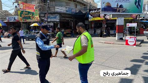 Rafah, southern Gaza Strip: Members of Hamas hand out sweets to passers ...