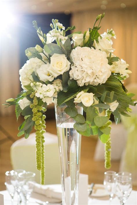 Trailing floral simple white wedding table flower centrepieces | Flower ...