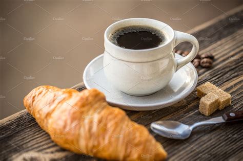 Coffee and croissant featuring croissant, dessert, and caffeine | Food Images ~ Creative Market