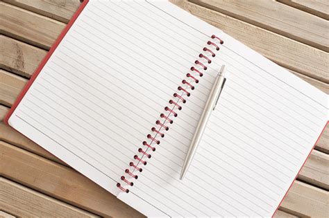 Free Stock Photo 10817 Blank New Page of a Spiral Notes with Pen | freeimageslive