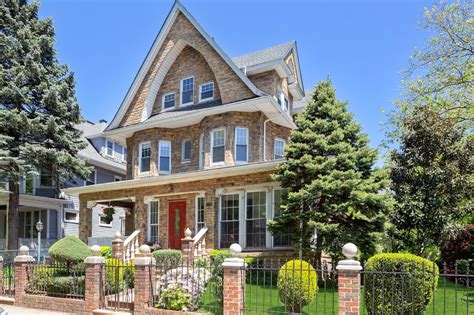 For $2.5M, this historic Victorian in Ditmas Park has a suburban yard and two-car garage | 6sqft