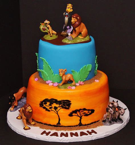 a birthday cake with the theme of disney's lion king and jungle animals on it