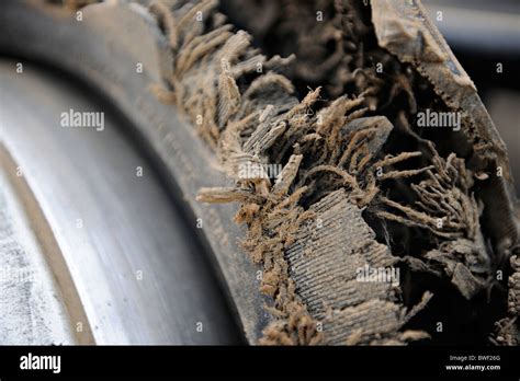 Broken car tire Stock Photo - Alamy