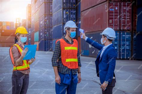 Premium Photo | Portrait team dock workers posing under working and ...