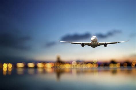 HD wallpaper: white aeroplan, sea, the sky, flight, the city, lights, the plane | Wallpaper Flare