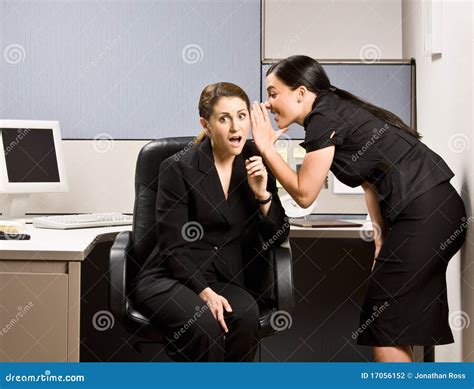 Co-workers gossiping stock photo. Image of colleague - 17056152