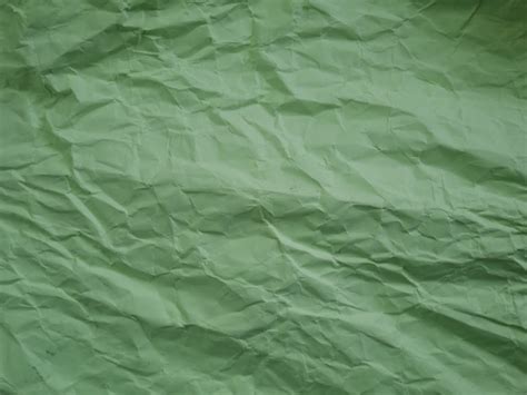 Premium Photo | Crumpled green paper background