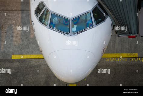 Pilots of a Lufthansa Airbus A320 prepare for the flight in the cockpit ...