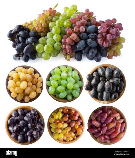 Mixed grapes of different varieties. Grapes in a wooden bowl isolated ...