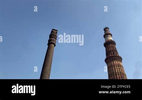 Qutub Minar and its ruins at Qutub complex; famous for its architecture ...