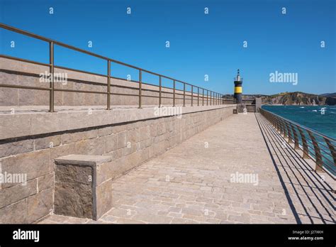 Lighthouse in Comillas port, Cantabria, Spain Stock Photo - Alamy