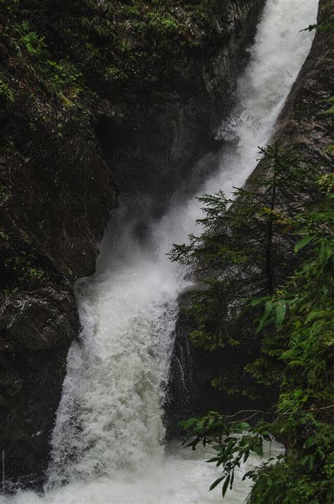 "Cascading Waterfall In A Gorge" by Stocksy Contributor "Neil Warburton" - Stocksy