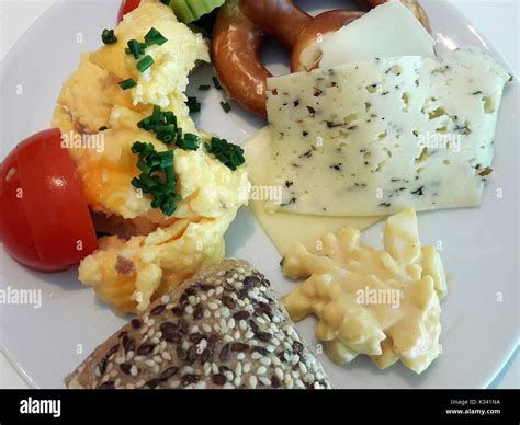 Healthy German Breakfast, scrambled eggs, cheese, pretzel Stock Photo ...