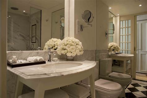 Elegant white marble bathrooms are a feature of all rooms and suites at The Kingsbury Hotel ...