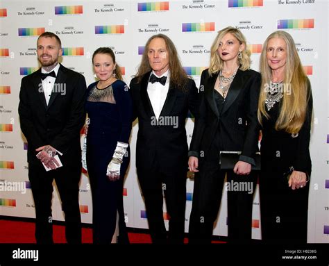 Timothy B. Schmidt, center, and his wife, Jean, right, arrive with ...