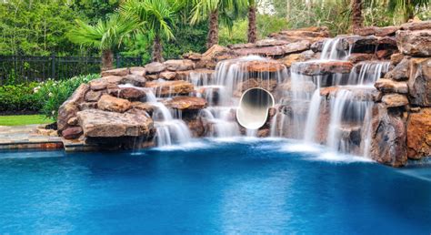 Customize Your Pool With a Beautiful Rock Waterfall - Platinum Pools