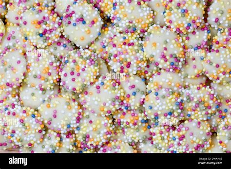 White chocolate buttons with coloured sprinkles or hundreds and ...