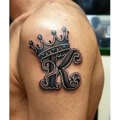 a man with a crown tattoo on his shoulder