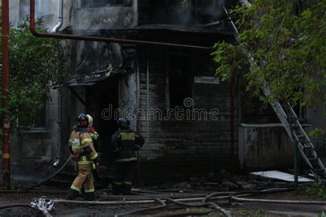 Firefighters Extinguish a Fire in an Old House Stock Image - Image of ...