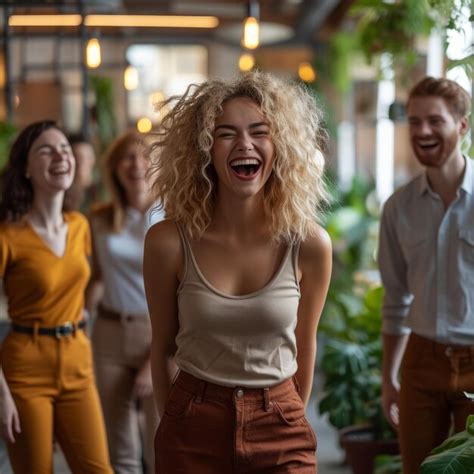 Premium Photo | Laughing woman with friends in the background