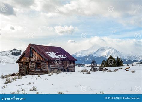 Rickety Old Cabin New Stanley Idaho in Winter with Sawtooth Mountain Range Stock Photo - Image ...