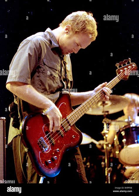 Pearl Jam's bass guitar Jeff Ament performing at the Tweeter Center in Mansfield Ma USA august ...