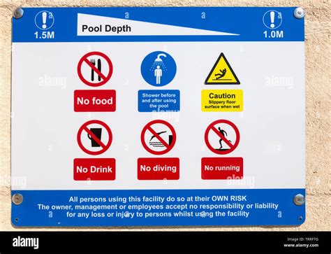 Swimming pool safety signs Stock Photo - Alamy