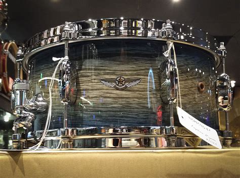 a close up of a drum on display in a room with lights and other items