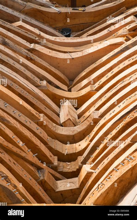 detail of keel construction of a traditional wooden dhow cargo ship being built in shipyard ...