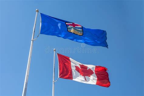 An Alberta Flag on Top of a Canada Flag Waving Stock Image - Image of ...