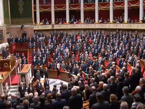 France's National Assembly spontaneously erupts in French anthem during moment of silence for ...