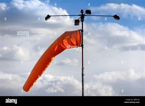 Orange windsock at an airport Stock Photo - Alamy