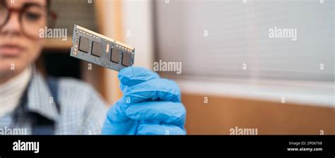 Laptop repair engineer holding random access memory Ram in computer ...