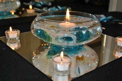 Simple Centerpieces Floating Candle Bowls from www.orientaltrading.com..... Candles, flowers ...