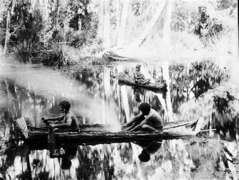 Aboriginal men with fire in bark canoe - from my language group in The Wimmera, Victori ...