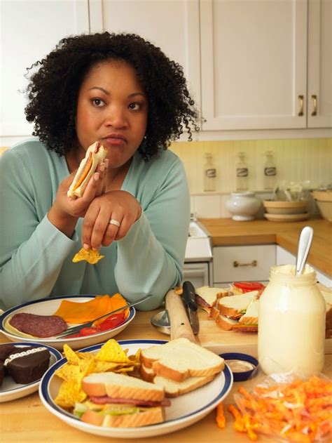 woman-eating-junk-food-in-kitchen