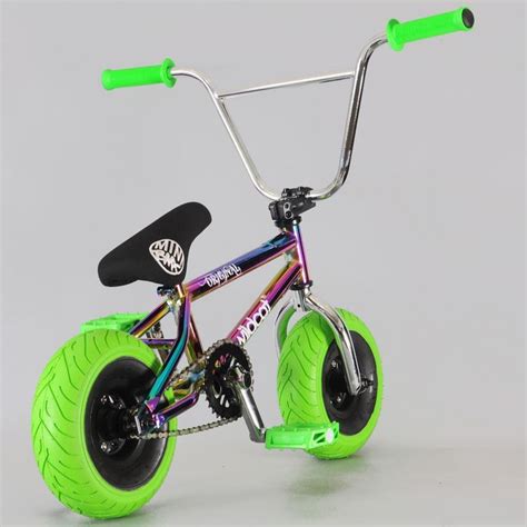 a green and black bike with two wheels on the front, one wheel has been turned upside down