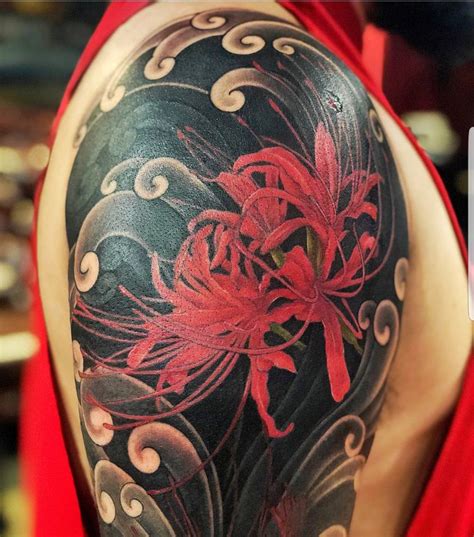 Red spider Lily tattoo with traditional Japanese clouds | Lily tattoo, Lily tattoo design ...