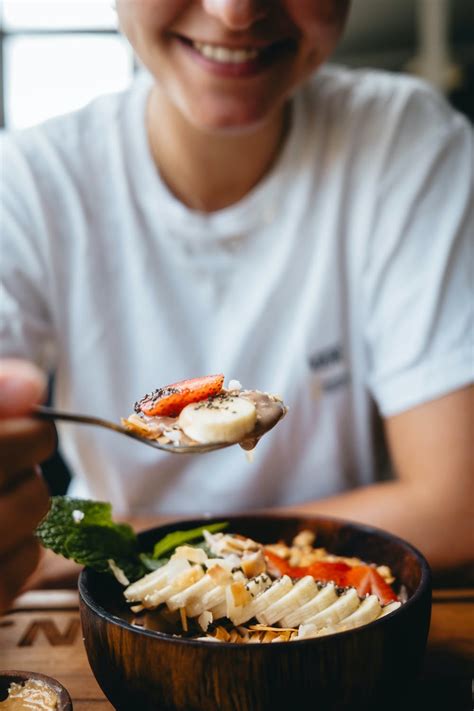 Smiling Person Eating Breakfast · Free Stock Photo