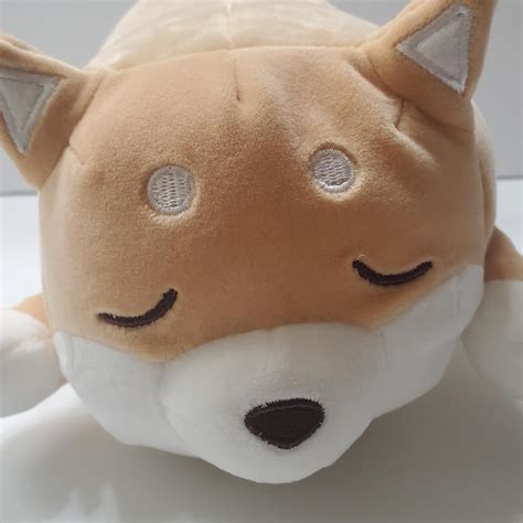 This little plush Shiba Inu is out cold, much like... - Depop