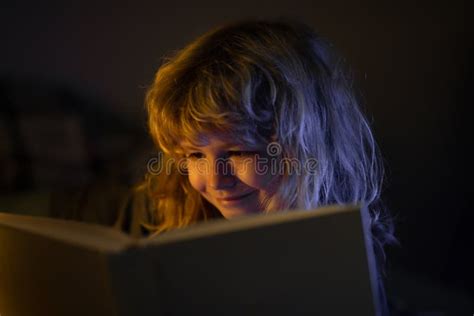 Child Reading Bedtime Story in Dark Room. Kid Reading a Book in Bed ...