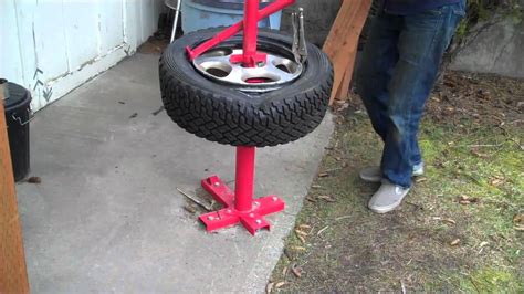 Mounting a rally tire with a harbor freight manual tire changer. - YouTube