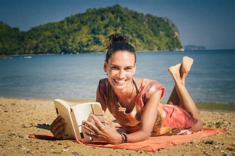 Woman Reading Book while Enjoying the Sunshine at the Beach Stock Photo - Image of brunette ...