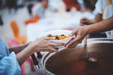 Volunteers Give Away Free Food To Hungry People : Concept Of Care And Feeding Stock Image ...