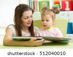 Baby Looking At The Book Free Stock Photo - Public Domain Pictures