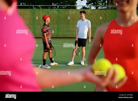 Mixed doubles tennis, players begins the game Stock Photo - Alamy